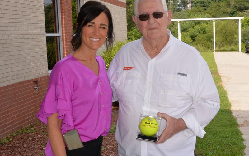 Claude Rogers presented Copper Basin High School Principal Holly Smith with a UT Lady Vols softball autographed by Ashley Rogers in memory of her dad, Loring, a 1982 graduate of CBHS.