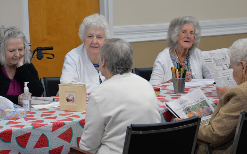 Regular visitors at the Fannin County Senior Center, from left, Peggy Stancil, Ruby Rhodes, Queita McHan (back to camera) Betty Caldwell, Bernice Gilmore and Barbara Smith enjoy each other’s company in the senior center’s reopened main room.