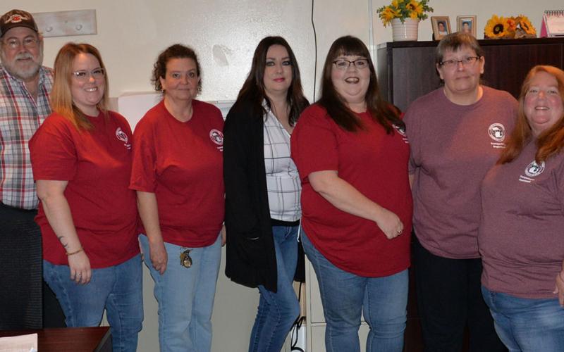 Not only did Fannin County’s seniors get to return to their home at the Fannin County Senior Center, but so did the crew from the Mountain Area Transportation System. Shown gathered in their new office last week are, from left, Mike Watkins, Jamie Thomas, Beverly Brown, Deborah Smith, Christina Sluce, Becky Davenport and Kristin Allen.