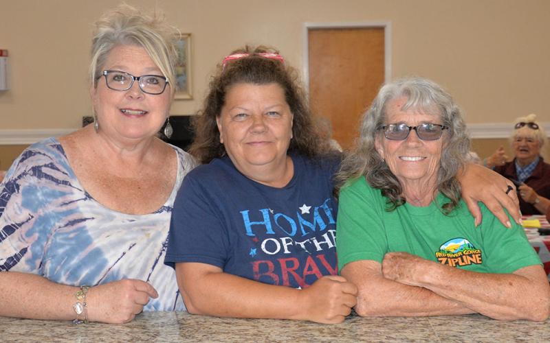 Pam Godfrey, center director, and her staff, Tammy Brown and Hazel Martin, from left, were all smiles as they welcomed seniors back to the Fannin County Senior Center on Reopening Day.