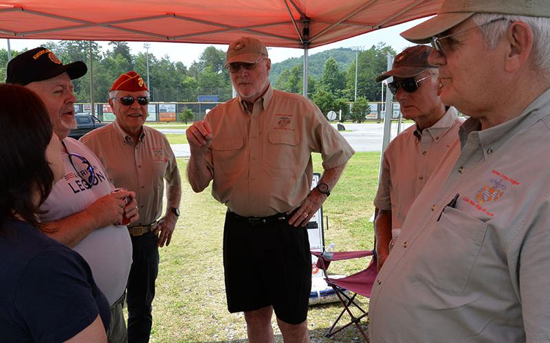 Discussing efforts to increase membership in local veterans organizations are, from left, Deb Calloway of the American Legion Auxiliary, Jim Callender of the American Legion, and Marine Corps League Detachment members Joel Warner, Dale Greene, Dick Evelyn and Ron Wikander.