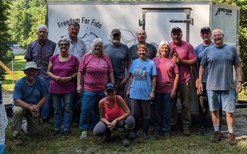 Freedom for Fido finished their 100th fence Thursday, July 27. Shown are the volunteers just after the fence build had been completed.