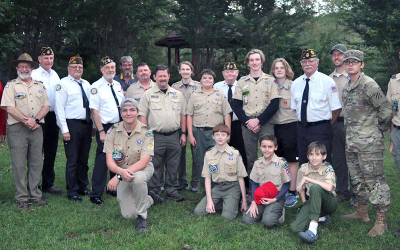 Boy Scouts from Troop 32 in Epworth, Webelos Cub Scouts from Pack 432 in Epworth, and members of the North Georgia Honor gathered at Ron Henry Horseshoe Bend Park outside McCaysville for a Flag Retirement Ceremony Tuesday, September 19. Those who took part in properly retiring the flag included, from left, kneeling in front, Sean Knight , Clay Dillard, Wyatt Craine and Dakota Davis; middle,  Nick Wimberley, David Lewis, Richard Crosely, Steve Strickland, Raymond Green, Patrick Thomas, Mathew Monroe, Bill St