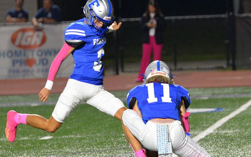 Matthew Ponton bears down on an extra point kick for the Fannin County Rebels in the victory over Gordon Central Friday night. The holder is Elijah Weaver.