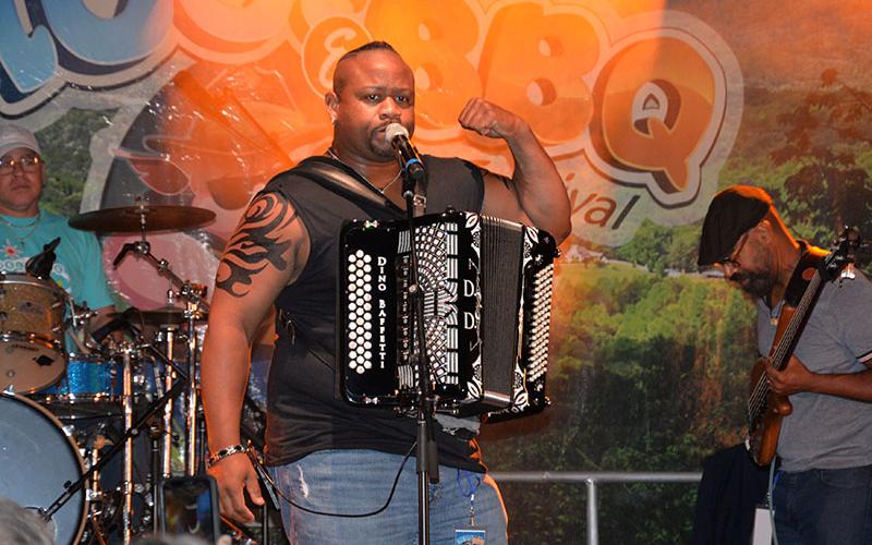 Dewayne Dopsie of Dewayne Dopsie and the Hellraisers electrified the Blues &amp; BBQ crowd in Blue Ridge Saturday night. It was the group’s third time appearing at the event, which marked its 12th anniversary this year. Despite rain most of the day, the sky held back for the last performances and the traditional huge crowd was on hand to end the day.