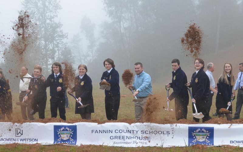 The real winners of the new greenhouse being constructed next to the Fannin County School System Agriculture Facility are the students and staff who will put it to use. Some of those individuals staged their own impromptu groundbreaking after the official ceremony last week. Taking part were, from left, Fannin County High School FFA officers Sarah Brawley, Dakoda Moore, Chase DeMar, Samantha Adkins, Brady Coleman, FFA Advisor Seth Davis, Jacob Williams, Roy Green, Abigail McFarland, and Kaleighann Ware.