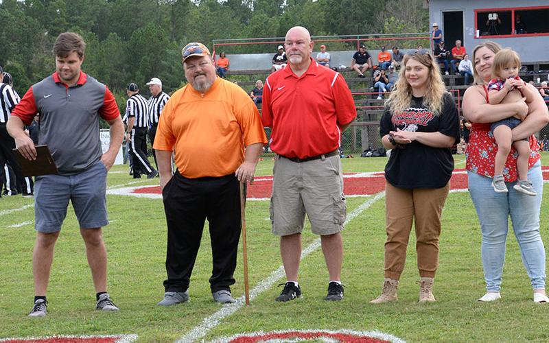 Mike Hamby was honored as the newly formed Copper Basin Alumni Association’s first Legend of the Game Friday night prior to the Cougars game with South Pittsburg. Shown during the recognition ceremony are, from left, Dylan Boggs, Hamby, John Spargo, Hamby’s daughters Lindsey and Lauren, and granddaughter Maeve Guzman.