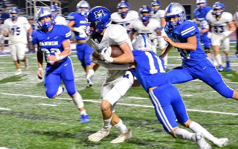Elijah Weaver (11), CJ Reece (23) and Luke Holsonback work to bring down a Model runner in Fannin Couny’s Region 7AA matchup with the visitors Friday night in Blue Ridge.