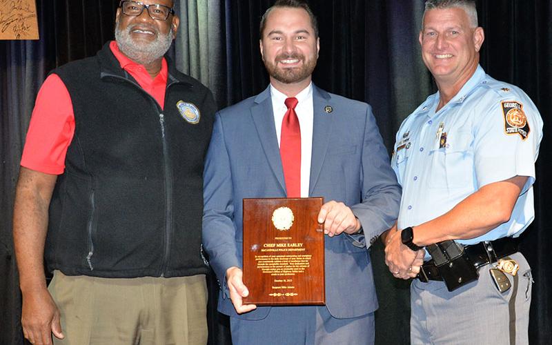 McCaysville Police Chief Michael Earley, center, was presented a special award for his work with the Governor’s Office of Highway Safety (GOHS). Allen Poole, left, director of GOHS, and Major Doug Wilson of the Georgia State Patrol presented the award.