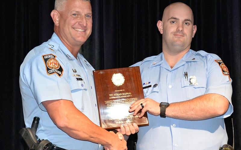 Trooper First Class Ethan Hajnal of Georgia State Patrol Post 27 in Blue Ridge was honored as Trooper of the Year at the Appalachian Trail Traffic Enforcement Network of the Governor’s Office of Highway Safety banquet in McCaysville last week. GSP Major Doug Wilson presented the award.