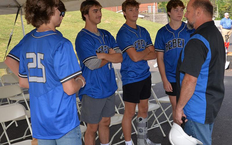 Fannin County school board Vice Chairman Mike Cole, right, hears what Fannin County Rebel baseball players have to say about the new facilities. Shown with Cole are, from left, Carter Fox, Christian Beavers (hidden behind Carter), Gaige Foster, Bryce Burnette, and Cole Stevenson.
