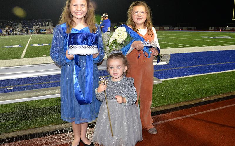 Layla Grimes, Jameson Rogers and Ryleigh Callihan, from left, stand ready to crown Fannin County High School’s homecoming king and queen.
