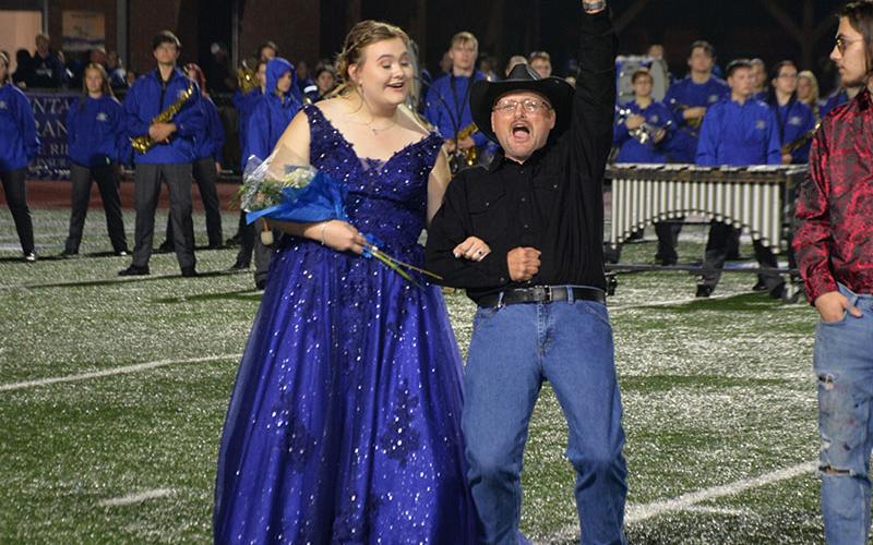 Katlin Jarrett and her dad, Ronald Jarrett, show their excitement when she was announced as Homecoming Queen at Fannin County High School Friday night.