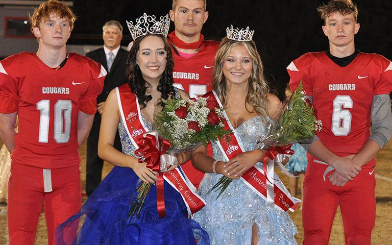 Maddie Cribbs (front left) was crowned homecoming queen and Kendra Deal homecoming princess by senior football players, back from left,  Kelle Shroth, Landon Allen, and Avery Crowder. The crowing concluded homecoming activities Friday night during halftime of the Copper Basin Cougars football game.