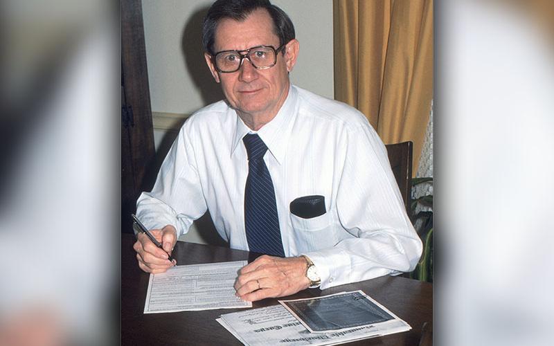 In 1980, Joel (Hatch) Hatchell retired from the Federal Aviation Administration. Pictured above, he signs his retirement paperwork. Hatch spent about 27 years working for the FAA.