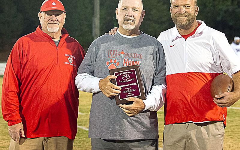 Former Copper Basin head football coach Mark Stone, center, was honored as a Legend of the Game Friday night. He is shown with John Spargo, left, of the school’s alumni association, and current head coach Chad Grabowski.