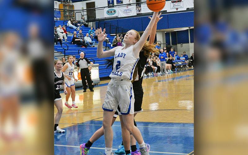 Lady Rebels Albany Cole (2) and Emma Holloway (44) pull down rebounds in Fannin County’s scrimmage against Andrews.