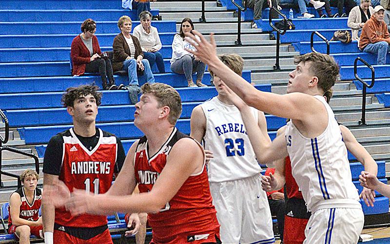 Isaiah Angel reaches for a loose ball during the Fannin County High School Rebels scrimmage against visiting Andrews High School last Wednesday night. The Rebels won the contest 64-53.