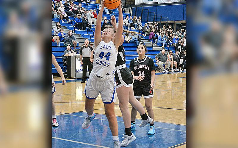 Lady Rebels Albany Cole (2) and Emma Holloway (44) pull down rebounds in Fannin County’s scrimmage against Andrews.