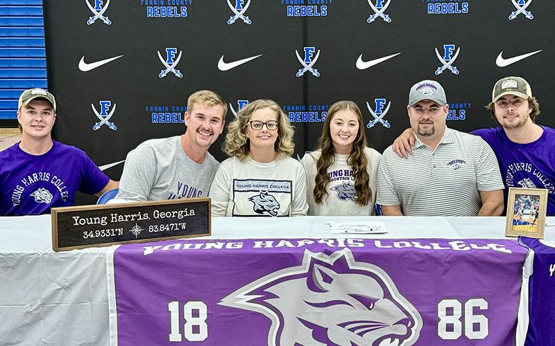 Courtney Davis, fourth from left, has signed her letter of intent to play basketball for Young Harris College. Shown during the official signing ceremony are, from left, Will Davis, Logan Davis, Christal Davis, Davis, Vincent Davis and Jackson Davis.
