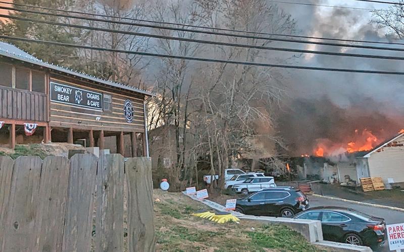 Battling the fire at Fieldstone Village included protecting businesses that front on East First Street including Smokey Bear Cigars and Cafe