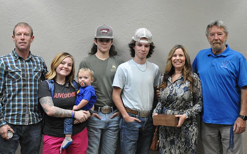 Chief Rob Stuart of Blue Ridge Police Department, together with Tony Cavallaro of The Vine in downtown Blue Ridge, presented each member of Brown’s family with their own challenge coin. Shown during the presentation are, from left, Brandon Quintrell, Chelsey Quintrell, Jaxson Quintrell, Mason Ramey, Brady Ramey, Kayla Fortenberry, and Brown’s son, Dan Brown.