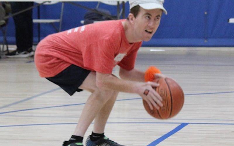 Nick Harris of Mineral Springs Center readies his shot as he competes with other Special Olympians.