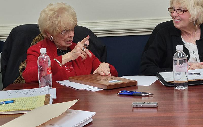 Sue Beaver, left, was specific in her instructions to Billy Wayne Chastain, who will take her seat on the McCaysville City Council in January. Councilwoman Gilita Carter seemed to enjoy Beaver’s orders to the new council member.