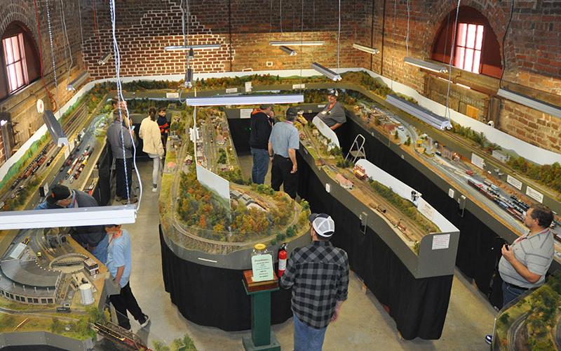 An overhead view of the Tri-State Model Railroaders “Old Line” shows how truly expansive the layout is. The layout is an “around the room” loop to loop. The model is an exact miniature replica of the Old Line Railroad that was a part of a project to link Knoxville, Tennessee, to Marietta, Georgia, by rail.