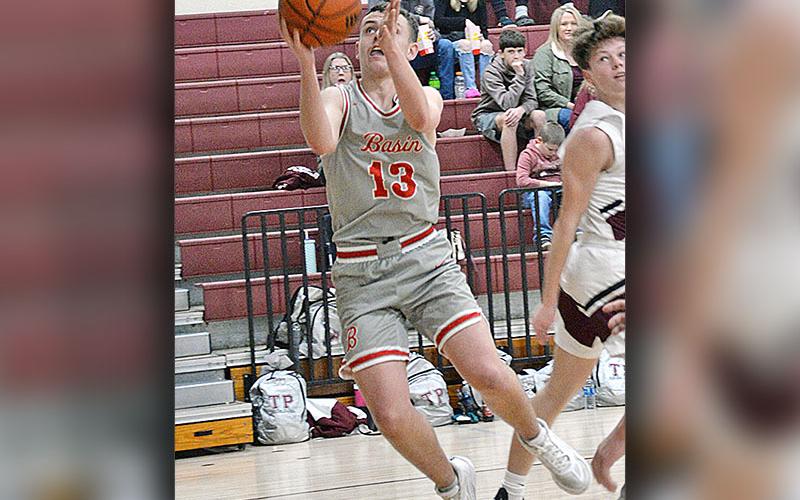 Carder Lance goes for two points for the Copper Basin Cougars. He led the Cougars with 16 points in their win over the Whitwell Tigers.