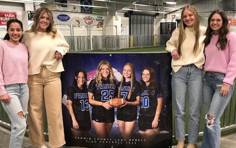Senior players received special recognition at the Fannin County High School flag football team banquet. Shown with a poster commemorating their efforts are, from left, Stephanie Kirk, Addison Smith, Anna Beth Minear, Jayden Bailey.
