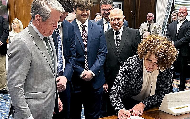 B. Alison Sosebee was sworn in as the new Superior Court judge for the Appalachian Judicial Circuit Wednesday, January 10, by Georgia Governor Brian Kemp. The ceremony took place in the governor’s office in the state Capitol in Atlanta. Sosebee was flanked by Kemp, left, and members of Sosebee’s family as she signed her Oath of Office following the swearing in ceremony.