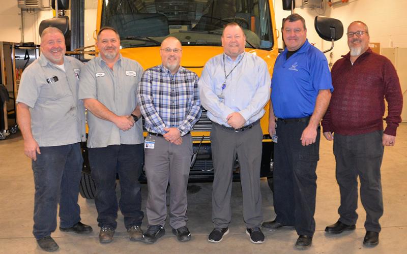 It’s all about family at the Fannin County School System Transportation Department. Retiring director Robert Ensley is shown with the garage staff portion of that family as he worked through the last days of his 45 in Fannin schools last week. Shown enjoying a laugh are, from left, Tom Cook, Rodney Ensley, Chris Drury, Robert Ensley, Denver Foster, and Tommy Jourdan.