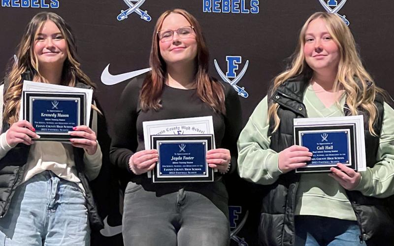 Kennedy Mason, Jayda Foster, and Cali Hall, from left, were recognized for their work as the football team’s trainers.