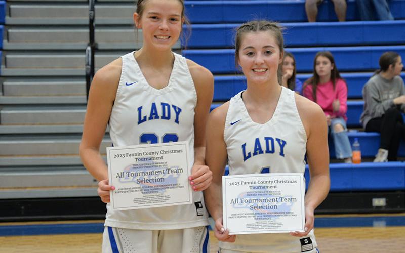 Lady Rebels Macy Hawkins, left, and Courtney Davis received All Tournament honors in the Fannin County High School Christmas tournament. Rebels Ben Bloch and Cole Gribble were named from the Rebels.