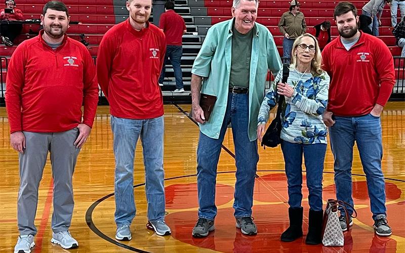 Larry Cantrell was honored by the Copper Basin Alumni Association as a Legend of the Game when the Cougars hosted Lookout Valley. Shown during a plaque presentation are, from left, Matt Ray, Brett Curtis, Cantrell, Connie Cantrell and Dylan Boggs.