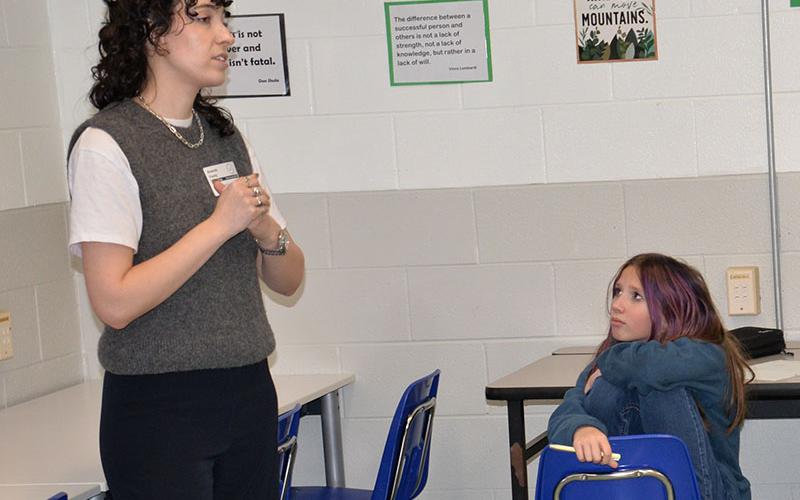 Ava Faries listens closely as Amanda Foody talks about her passion for writing with students at Fannin County Middle School (FCMS) last week. Foody is a New York Times best selling author who was invited to the school by Scott Moat, the media specialist at FCMS.