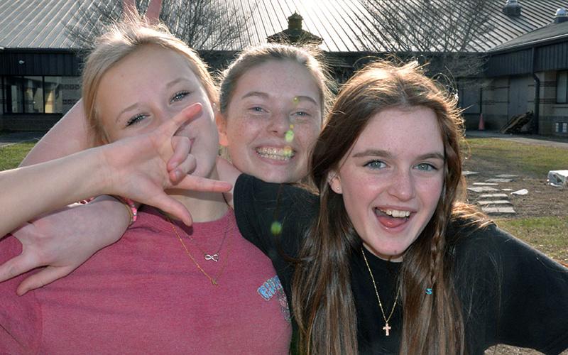 Taking a break to clown around after helping load items for Fannin County’s homeless population were, from left, Karleigh-Jayne Stiles, Lillie Williams, and Addison Head. The three are members of the Fellowship of Christian Athletes at the school, the club that collected the most items in a competition started by an idea in Alesha Stiles’ Graphic Design Class.