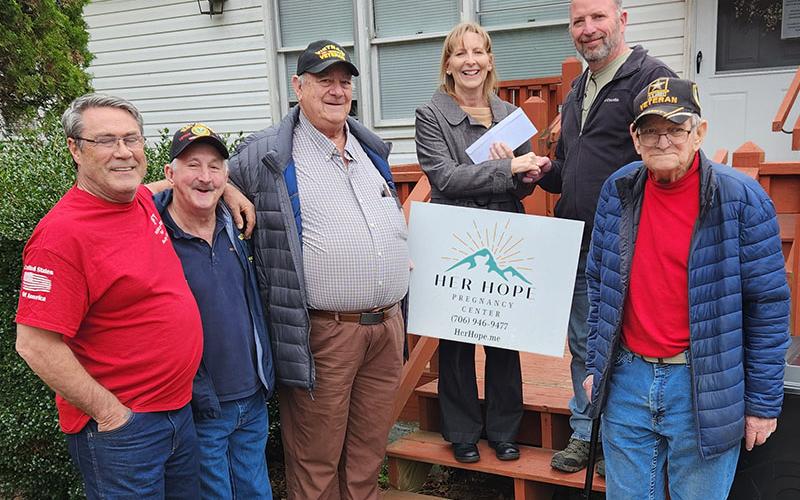 Lori Kantner Executive Director of Her Hope Pregnancy Center recently received a donation from Blue Ridge Post 6570 of the Veterans of Foreign Wars. Shown during the presentation of the donation are, from left, VFW members Julian Black, Sonny Payne, Paul Hunter, Kantner, VFW Commander Harold Bargeron and VFW member Fred Brandhuber.