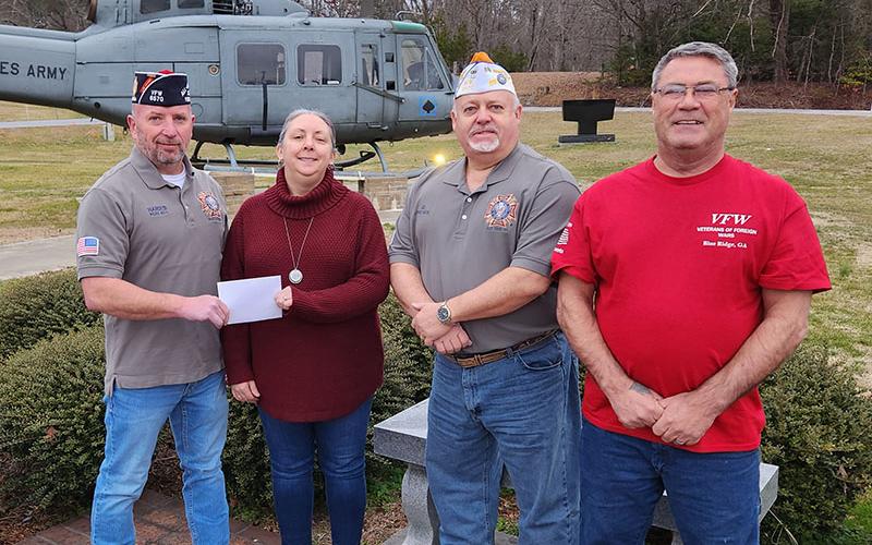Harold Bargeron, commander of Blue Ridge Post 6570 of the Veterans of Foreign Wars, from left, is shown presenting a donation to Mandi Hyde of Fannin County Family Connection. Joining Bargeron were VFW members James Callender and Julian Black. Serving the community is one of the core values of the VFW.