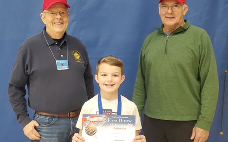 Tanner Jackson was the male winner for the nine year old group. He is shown with Dave Piermanleft, and Don Wirtz.