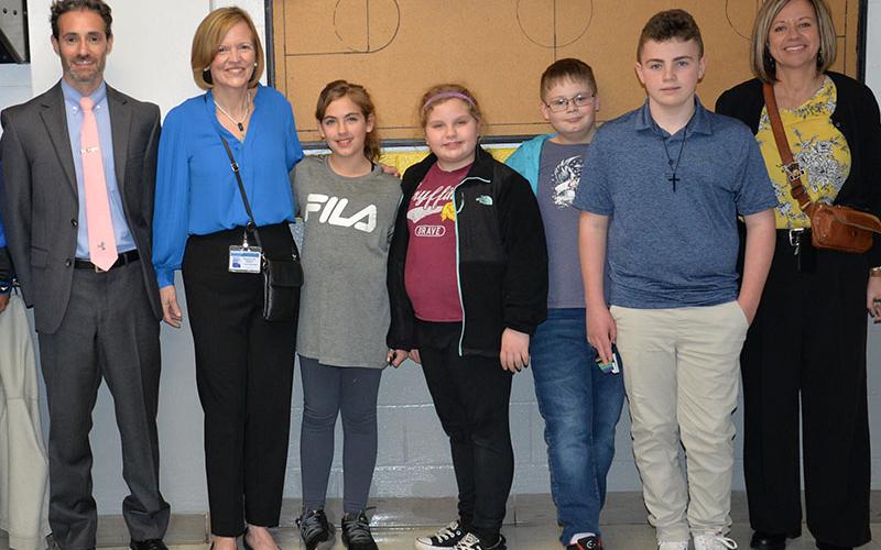 Chief Academic Officer Lucas Roof, Fannin County School Superintendent Shannon Dillard, and West Fannin Elementary School Principal Allison Danner express their appreciation for the wonderful student tour guides who led the way during the local school board training. Following the event are, from left, Roof, Dillard, Bevin Stonecipher, Ellee Gibbs, Tom Rose, Luke Snider, and Danner.