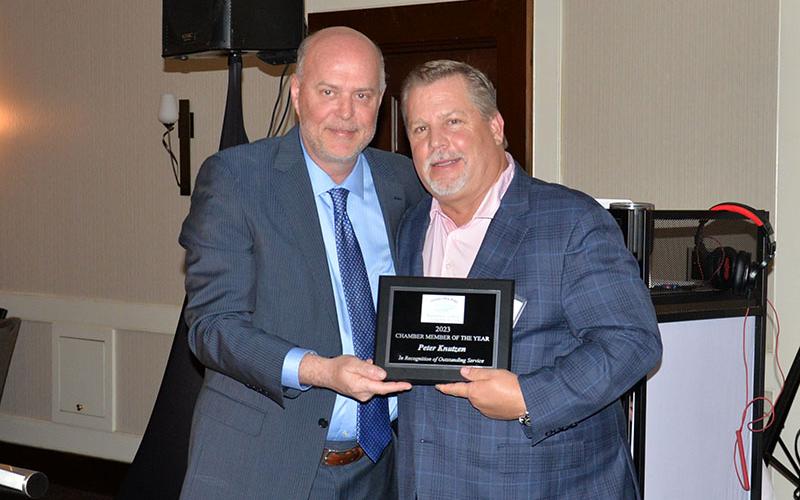 Peter Knutzen, right, was named the Member of the Year by the Fannin County Chamber of Commerce. He was presented his award by Chamber board member Doug Miracle during the organization’s annual banquet Saturday night.