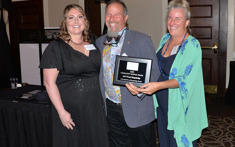 Danny Mellman and Michelle Moran of Lit’l Pond Hospitality received the Chamber’s Community Service Award from outgoing Chamber Chairwoman Suzanne Davenport.