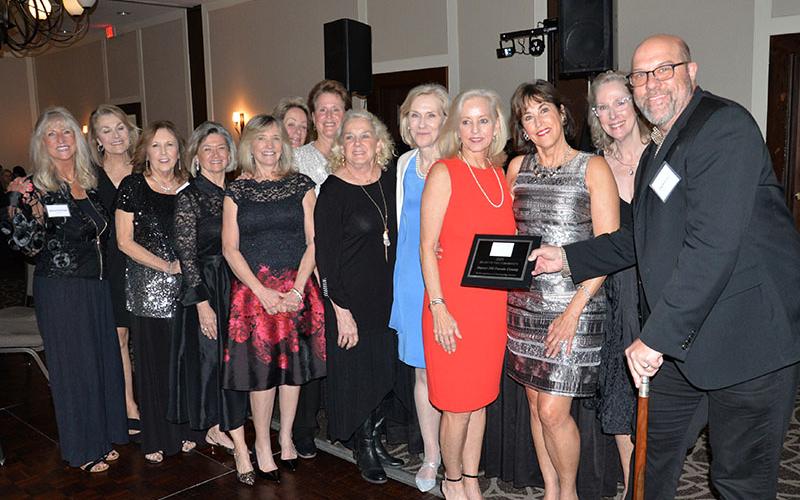 Impact 100 received the Heart of the Community Award from the Fannin County Chamber of Commerce. Chamber board Chairman Troy Shirbroun, right, presented the award to Impact 100 board members, from left, Sherry Echelberger, Revonda Rich,Connie Stinson, Carolyn Kibler, Amy Stokes Janice Marko, Kandy Key, Cindy Glueckert, Kim Kappel, Sherry Lang, Joann Myers, and Lisa Brown.