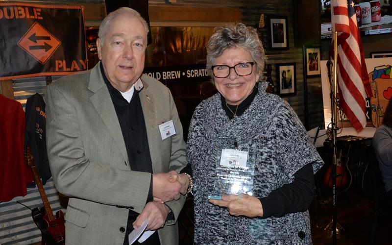 Kim King of the Knitwits was honored with the Heart for Children Champion by Snack in a Backpack. Snack Treasurer Jeff O’Neill presented the award.