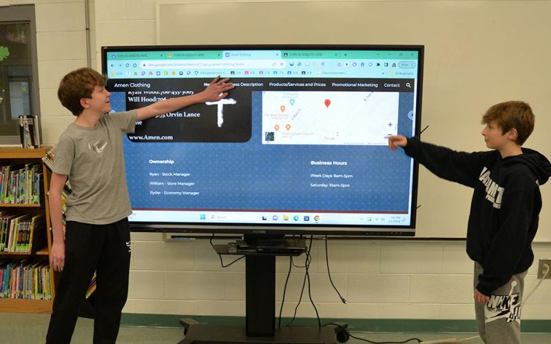 Ryan Wood, left, and Ryder Hanson presented their business plan for Amen Clothing, a Christian based clothing company, to the Fannin County Middle School Shark Tank judges.