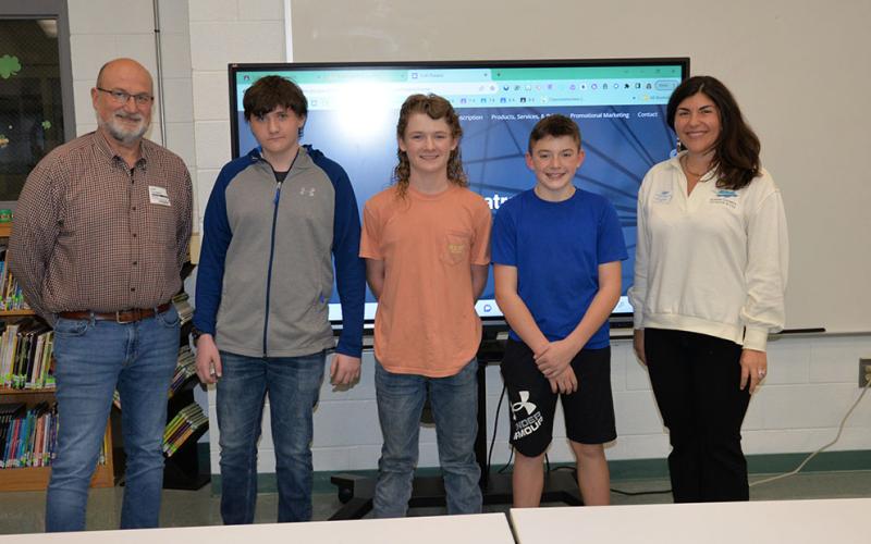 Fannin County Middle School’s Shark Tank second place winners are in the welding business. Shown following the presentation are, from left, Fannin County Economic Development Director Erick Youngberg, Brady Thomas, Trenton Flowers, Wyatt Flowers, and Fannin County Chamber of Commerce President Christie Gribble.