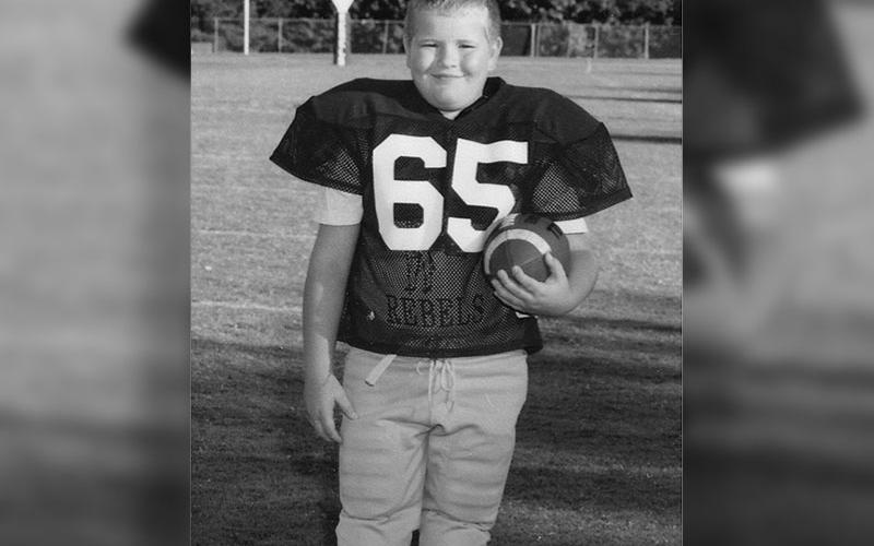 A young Geoffrey Daves stands ready. He began his football career with the Fannin Recreation League.