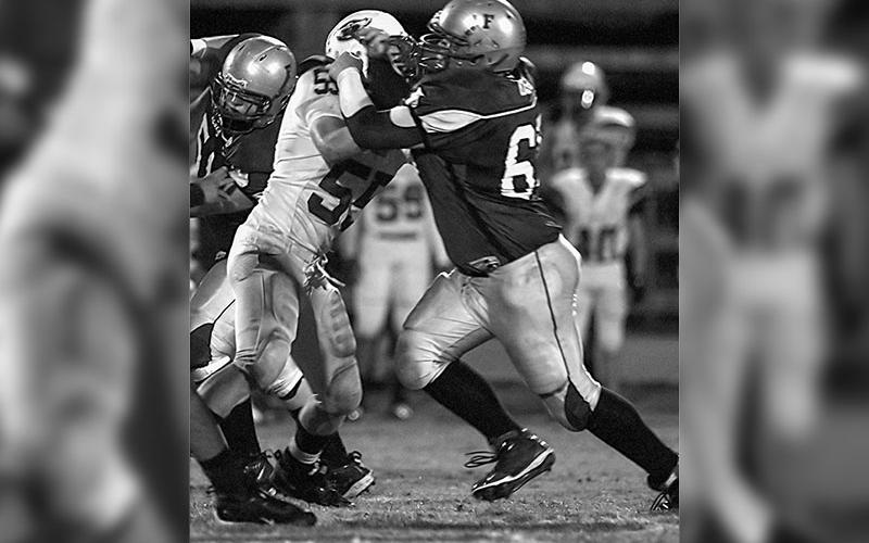 Geoffrey Daves fighting in the trenches at Fannin High. Geoffrey says he did occasionally allow his competitive side to appear toiling in the trenches as a younger man.